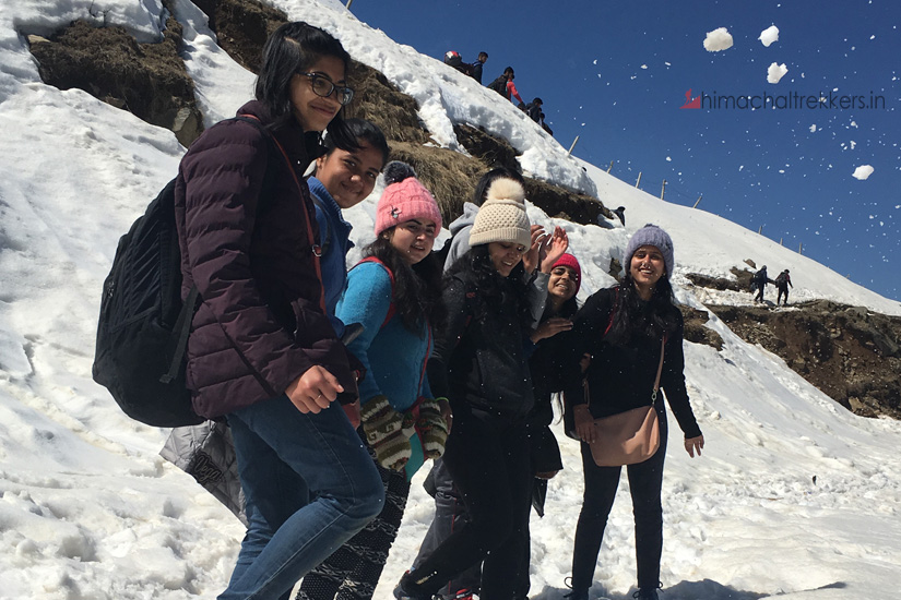 girls enjoying with snow