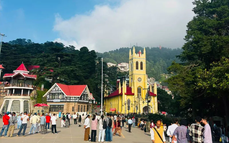 Crowded Ridge in Shimla featuring the iconic yellow Christ Church and colonial buildings